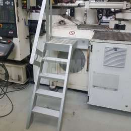 Fixed ship ladder for machine access Ship ladder with single guardrail and 5 steps for machine maintenance access.